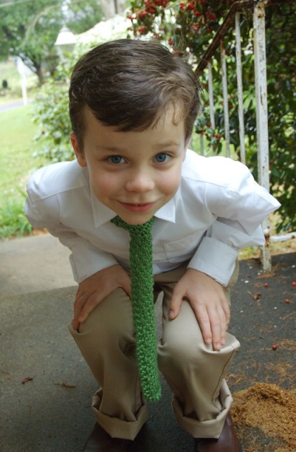 Little boy with green knit tie