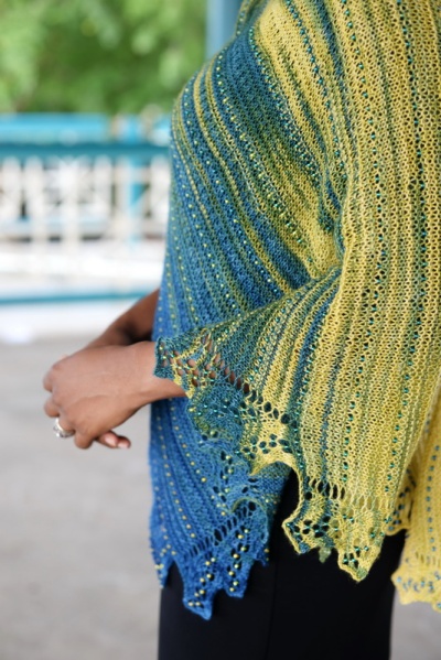 Lace shawl worked in gradient yarn with gradient beads by Barbara Benson.