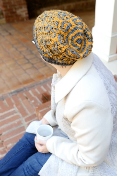 Cables are Cool: A two color cable hat featuring slipped stitch color work by Barbara Benson