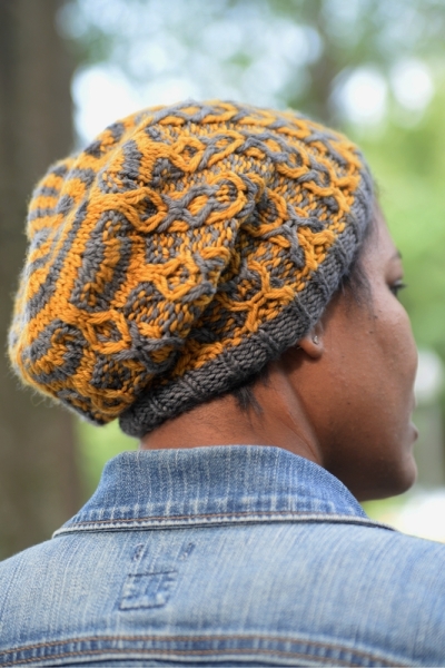 Cables are Cool: A two color cable hat featuring slipped stitch color work by Barbara Benson