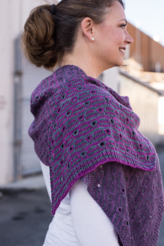 The Peephole Stole - a rectangular striped stole knit on the bias in gradient yarn. By Barbara Beson