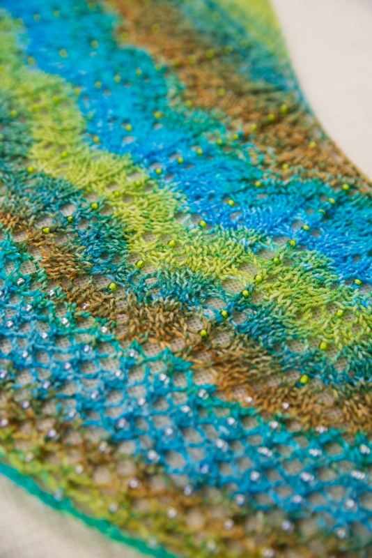 Each to Each by Barbara Benson: a beaded, crescent shaped shawl in gradient dyed yarn.
